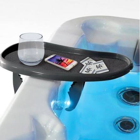 Life Spa Tray Table attached to the side of a hot tub holding drinks, snacks and a book.