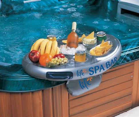Inflatable floating drinks caddy for swimming pools and hot tubs with built-in cup holders and food compartments.