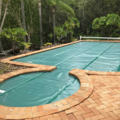 Daisy Titanium Green solar pool cover on swimming pool