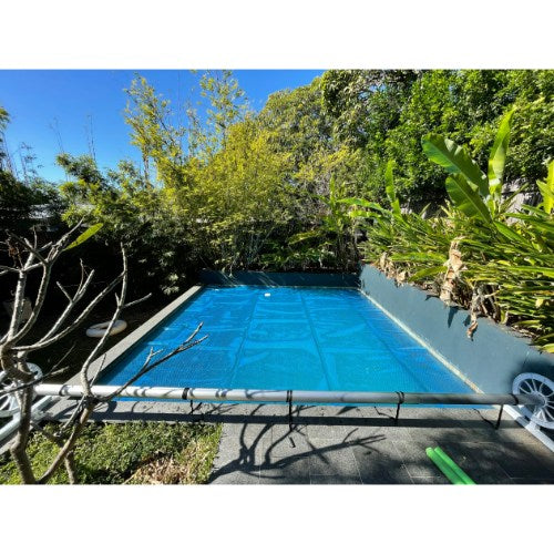 ABGAL Oasis 500 Micron Blue Pool Cover installed on backyard swimming pool