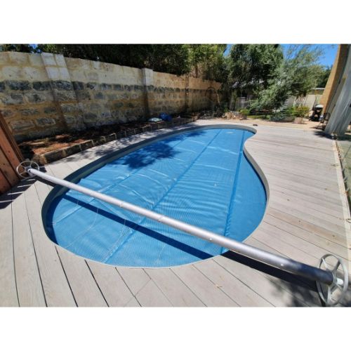 Pool cover neatly rolled onto Daisy SQ stationary roller
