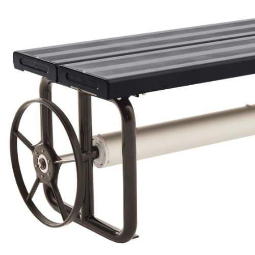 Hidden Charcoal pool cover roller installed beside a modern swimming pool