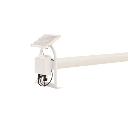 Wall mounted motorised pool cover roller with solar charging beside a swimming pool